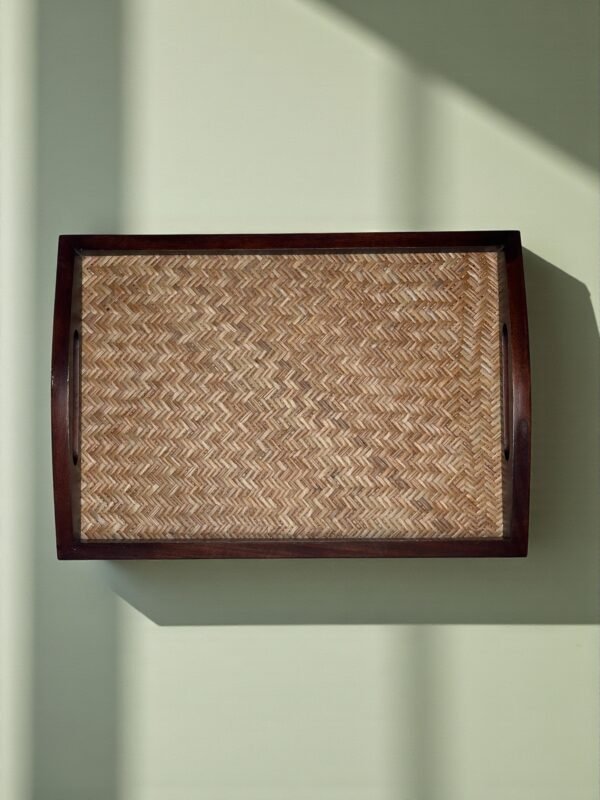 Premium Mango Wood with Cane Inlay – Handcrafted from seasoned mango wood, featuring a woven cane mat base for a natural, textured look - Artisan Handcrafted Detailing – Each tray is carefully made by skilled artisans, blending organic cane with durable wood for timeless elegance - Elegant Rectangular Design – Spacious 40 cm tray ideal for serving tea, coffee, snacks, or cocktails, and for styling as a decorative centerpiece - Durable & Eco-Friendly – Made from 100% natural, food-safe materials that are sustainable, non-toxic, and built to last - Perfect for Gifting – A thoughtful, versatile gift for housewarmings, weddings, festive occasions, or anyone who loves handcrafted home essentials"