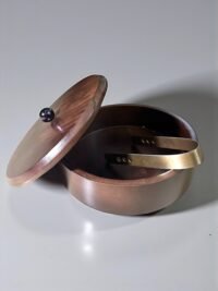 "- Premium Mango Wood – Handcrafted from seasoned mango wood with a polished finish, offering durability and a rich natural grain - Natural Heat Retention – Dense wood construction keeps rotis, chapatis, and tortillas warm and fresh for longer - Secure Wooden Lid with Knob – Ergonomic lid ensures freshness while providing an easy grip for serving - Multi-Purpose Storage – Ideal for rotis, parathas, tortillas, bread, or as a serving bowl for snacks and dry foods