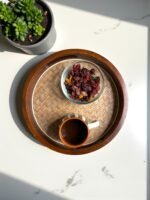 "- Premium Mango Wood with Cane Inlay ā Handcrafted from seasoned mango wood, featuring a woven cane mat base for a natural textured look - Two Elegant Finishes ā Available in Walnut and Natural wood tones, designed to complement a variety of home dĆ©cor styles - Versatile Serving Tray ā Ideal for serving tea, coffee, snacks, cocktails, or for styling candles, flowers, or books as a decorative centerpiece - Modern Round Design ā Sleek 12-inch circular shape blends rustic warmth with contemporary elegance - Durable & Eco-Friendly ā Made from 100% natural, food-safe mango wood and cane; sustainable, non-toxic, and built to last"