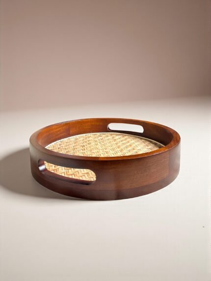 "- Premium Mango Wood with Cane Inlay – Handcrafted from seasoned mango wood, featuring a woven cane mat base for a natural textured look - Two Elegant Finishes – Available in Walnut and Natural wood tones, designed to complement a variety of home décor styles - Versatile Serving Tray – Ideal for serving tea, coffee, snacks, cocktails, or for styling candles, flowers, or books as a decorative centerpiece - Modern Round Design – Sleek 12-inch circular shape blends rustic warmth with contemporary elegance - Durable & Eco-Friendly – Made from 100% natural, food-safe mango wood and cane; sustainable, non-toxic, and built to last