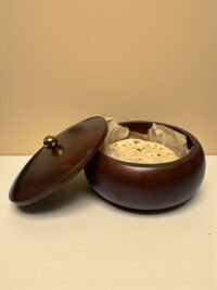 "- Premium Mango Wood – Handcrafted from seasoned mango wood with a polished finish, offering durability and a rich natural grain - Natural Heat Retention – Dense wood construction keeps rotis, chapatis, and tortillas warm and fresh for longer - Secure Wooden Lid with Knob – Ergonomic lid ensures freshness while providing an easy grip for serving - Multi-Purpose Storage – Ideal for rotis, parathas, tortillas, bread, or as a serving bowl for snacks and dry foods