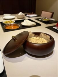 "- Premium Mango Wood – Handcrafted from seasoned mango wood with a polished finish, offering durability and a rich natural grain - Natural Heat Retention – Dense wood construction keeps rotis, chapatis, and tortillas warm and fresh for longer - Secure Wooden Lid with Knob – Ergonomic lid ensures freshness while providing an easy grip for serving - Multi-Purpose Storage – Ideal for rotis, parathas, tortillas, bread, or as a serving bowl for snacks and dry foods